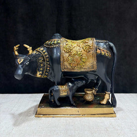 This 6.7-inch Kamdhenu cow figurine is a beautiful representation of purity, prosperity, and spiritual blessings. Known as the divine cow in Hindu mythology, Kamdhenu is believed to grant every wish and bring abundance to its devotees. Crafted with intricate details, this figurine exudes a sense of holiness and serenity.