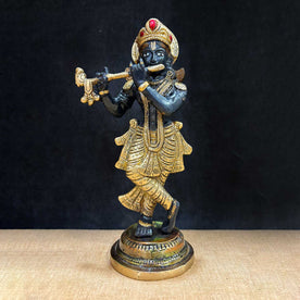  The 9.1 Inch Krishna Idol A Spiritual Icon of Joy and Devotion is a captivating representation of Lord Krishna's divine love and blissful energy. Crafted with exquisite detail, this idol showcases Krishna in a joyful and serene pose, with his flute in hand, symbolizing the music of the soul and the divine connection between the mortal and the eternal. 